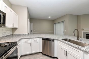 Kitchen with sink and faucet